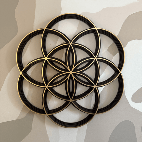 Decorative wall art of the Seed of Life on a neutral camouflage background