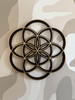 Decorative wall art of the Seed of Life on a neutral camouflage background
